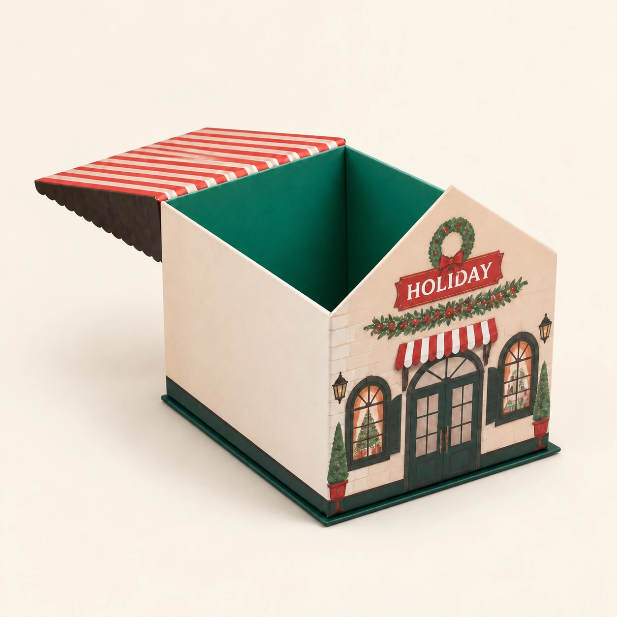 House-shaped Christmas gift box with an open red-and-cream striped roof, printed holiday storefront and green interior