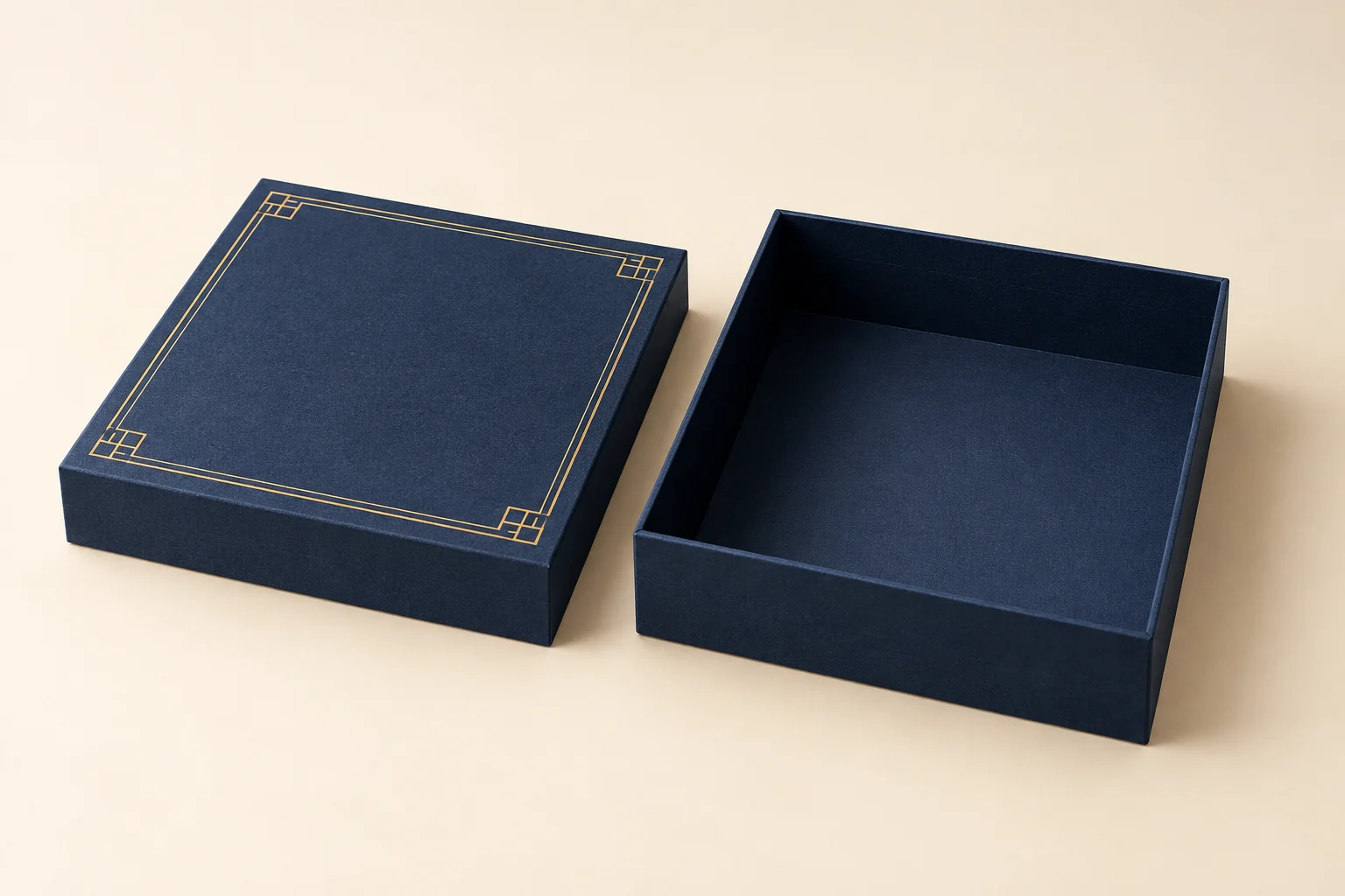 Navy rigid gift box with gold foil geometric border and separate lid