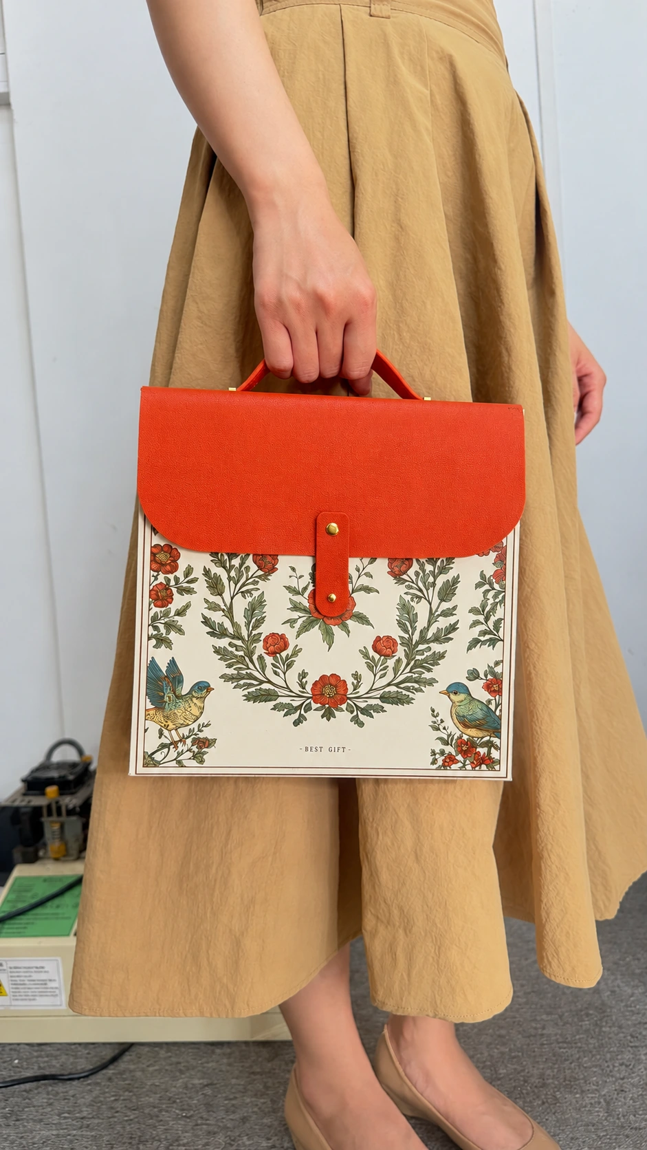 Hand-carried floral gift box showing the carry handle